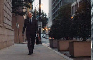 Assault lawyer Jeff Manciagli Walking on sidewalk towards Court Building